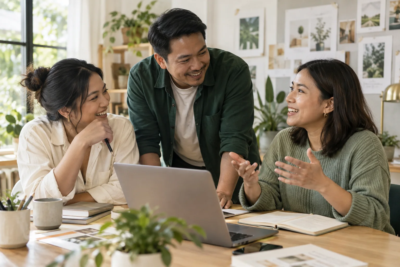 Illustrative photo of people collaborating around a laptop